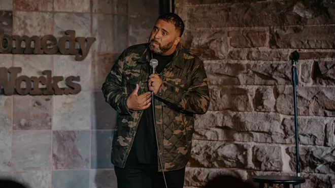 A comedian performs on stage at Comedy Works.