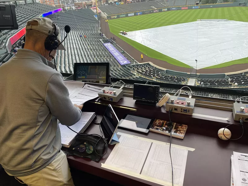 Image: man over coors field