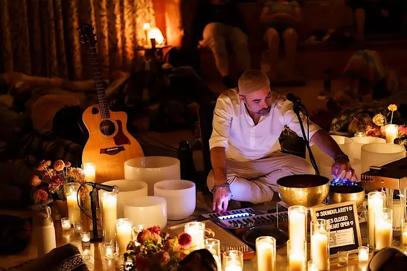 Image: man playing singing bowls