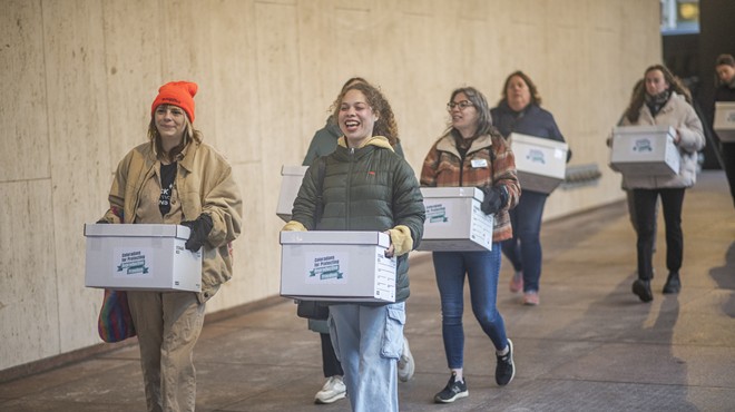 Members of Coloradans for Protecting Reproductive Freedom turn in 99 boxes of petition signatures in support of an abortion rights ballot measure proposal on April 18, 2024.