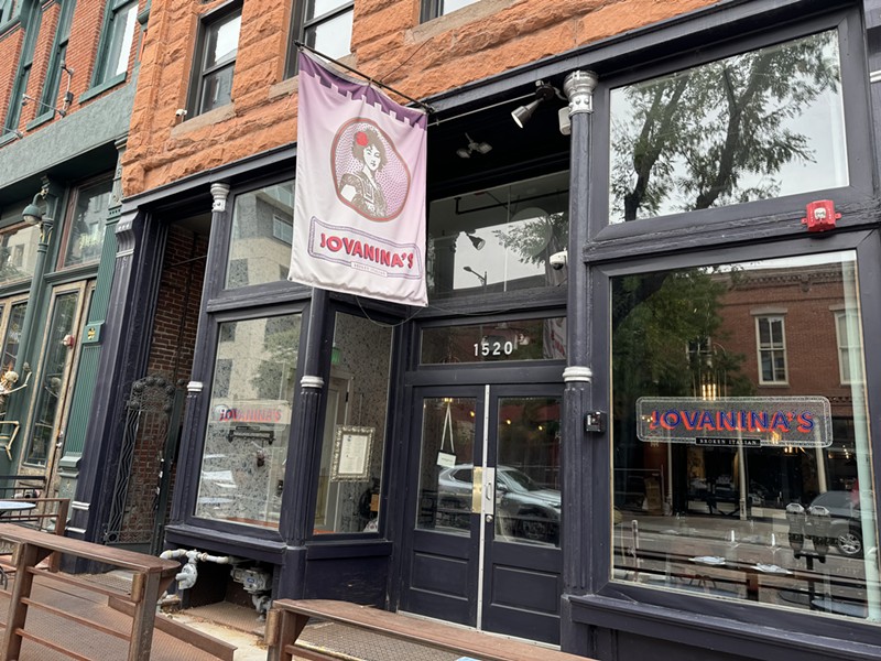 The flag and window signs at Jovanina's Broken Italian.