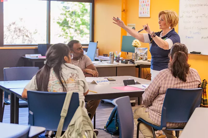 Image: Adult students listen in a class.
