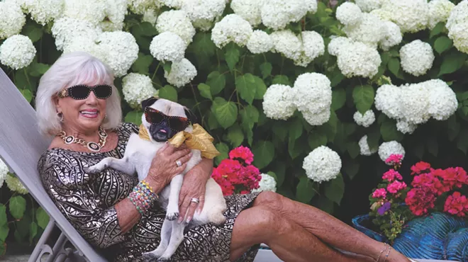 woman with her pug on a chiase lounge