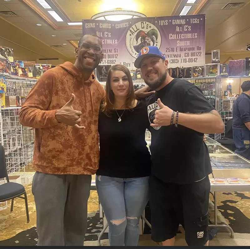 Image: Trish Farnsworth (center) poses with her husband and All C's co-owner James (right) and former Broncos lineman Orlando Franklin.