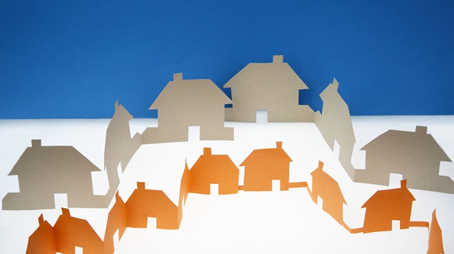 two rows of houses in paper silhouette