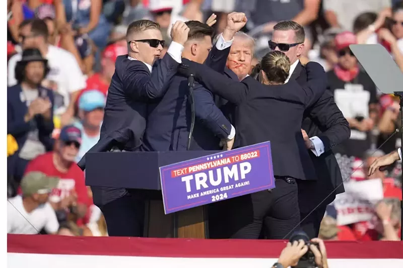 Image: trump surrounded by security after shooting