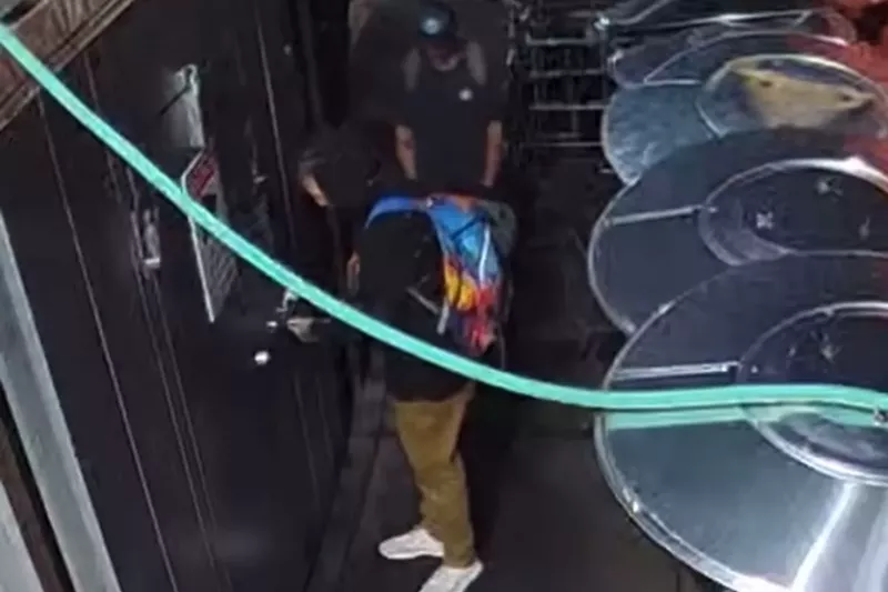 Image: People break into a walk-in