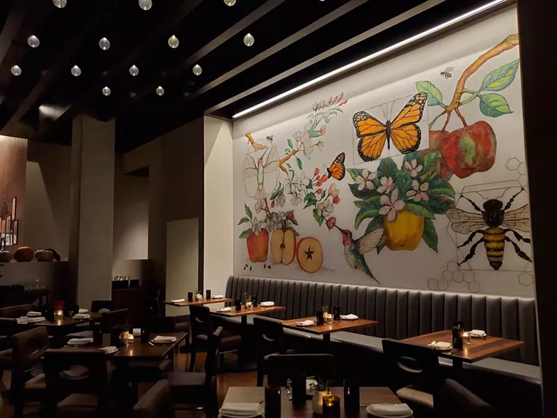 Image: a mural with flowers and fruit on a wall