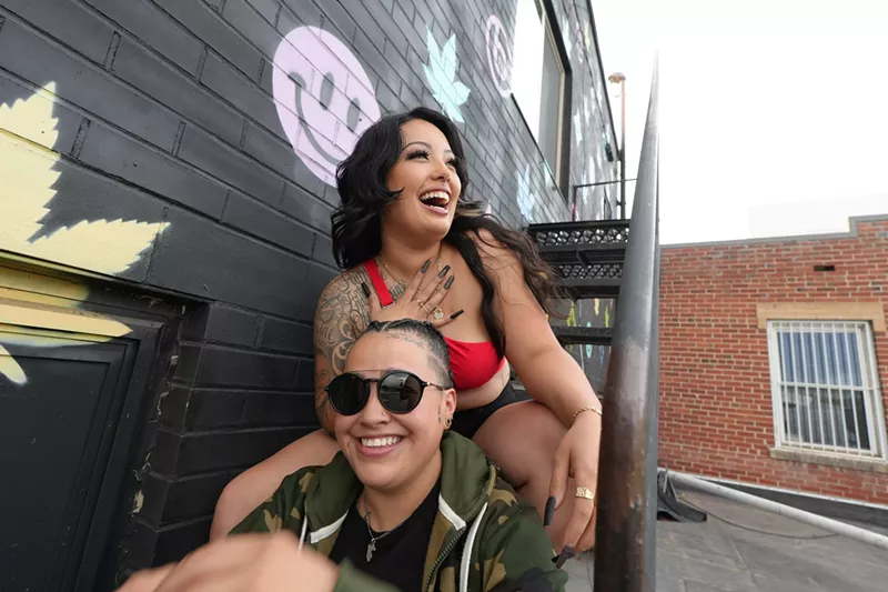 Image: Two people sitting on some stairs