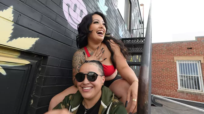 Two people sitting on some stairs