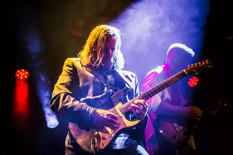 Image: man playing guitar