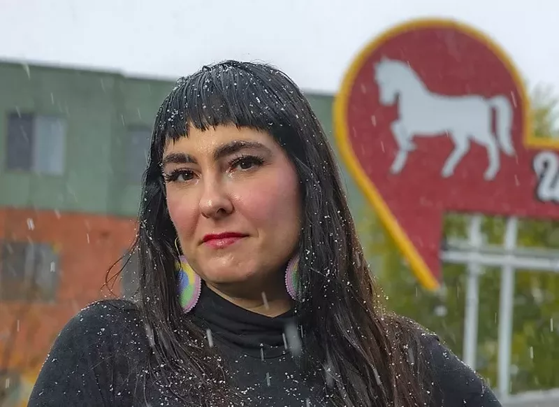 Image: Erika Wurth standing in front of the White Horse bar.