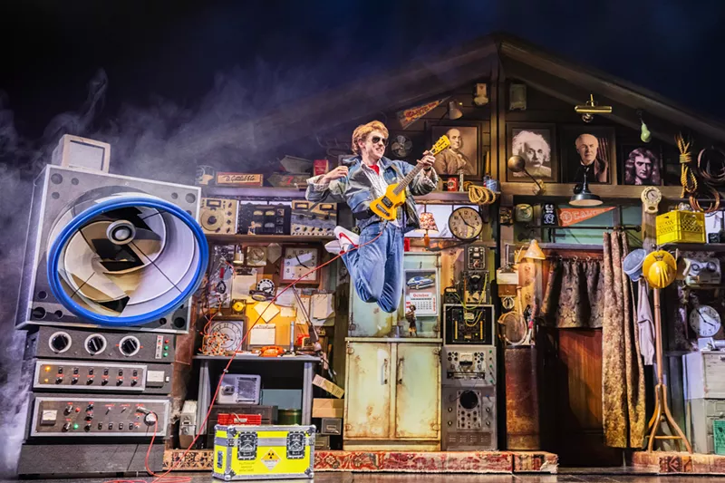 Image: stage with guy and guitar