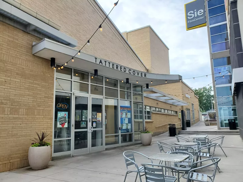 Image: outside of building with cafe chairs
