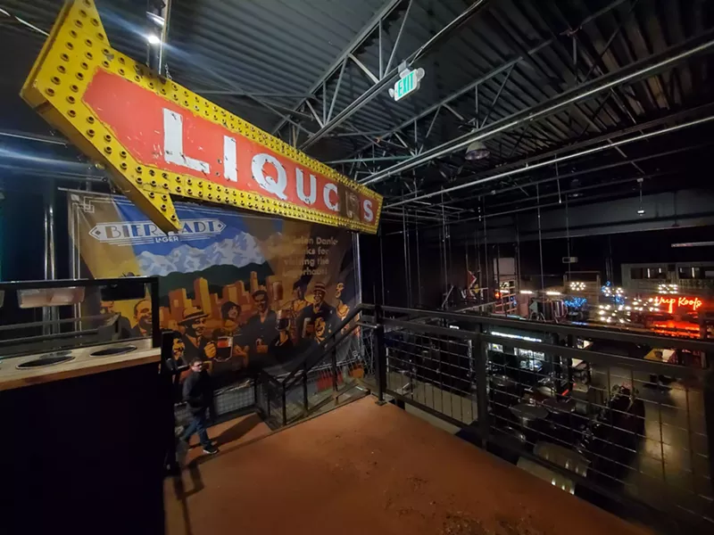Image: a vintage arrow "liquor" sign