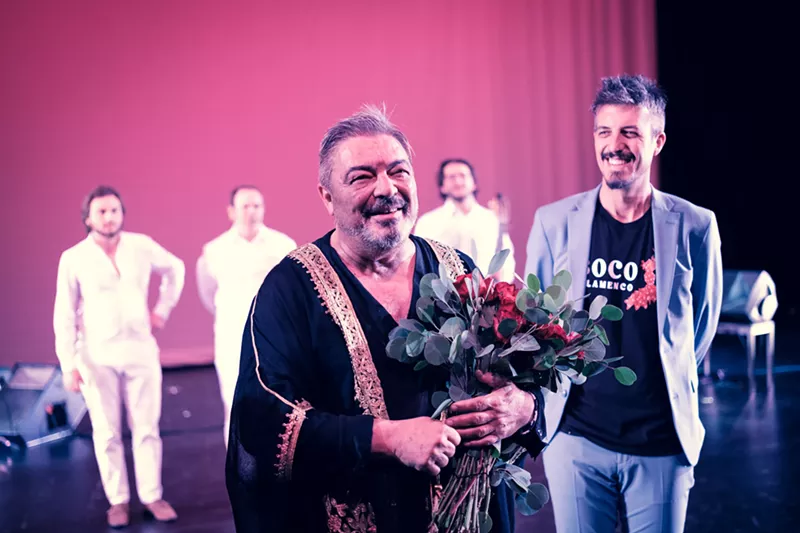 Image: man holding flowers