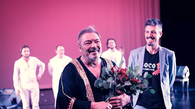 man holding flowers
