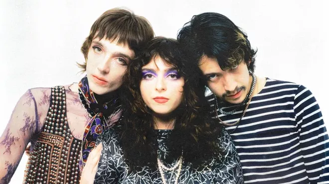 The three members of the Velveteers standing together