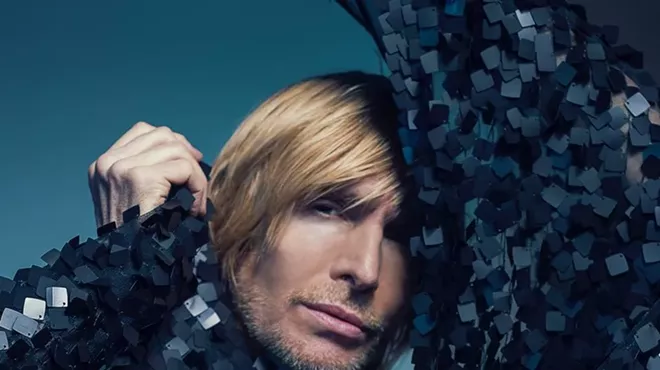 A man in a black sparkly outfit