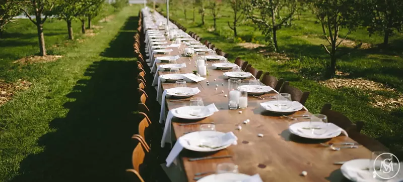 Image: long table set with dishes