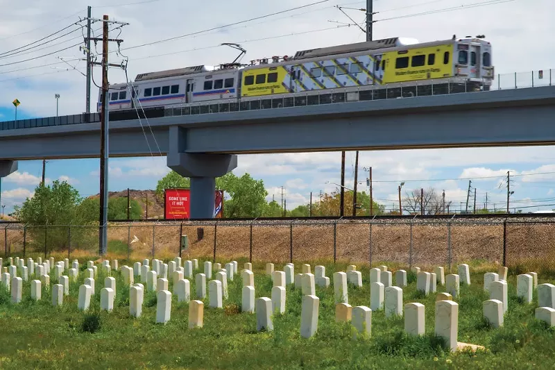 Image: train by graveyard