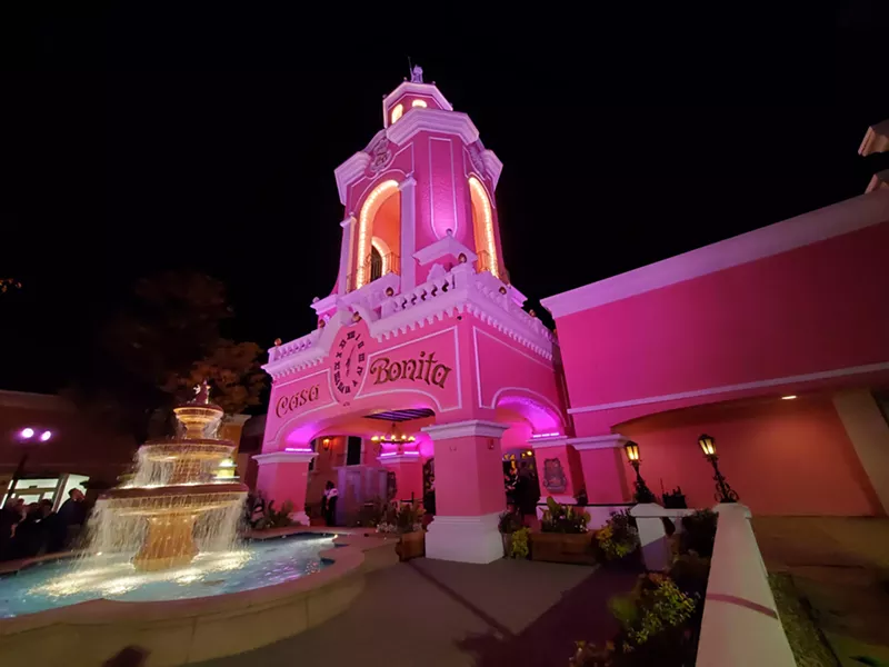 Image: pink restaurant that looks like old Mexico at night