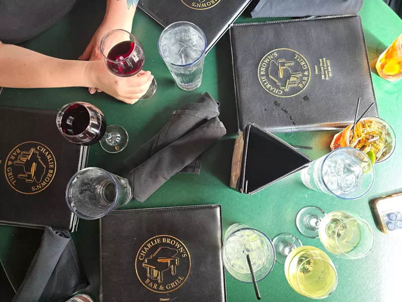Image: menus and various drinks on a table