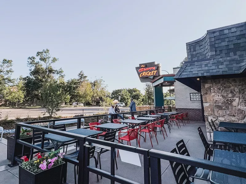 Image: a patio set with tables and chairs