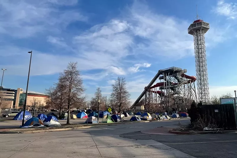 Image: A migrant encampment outside of Elitch Gardens has upwards of 60 people.