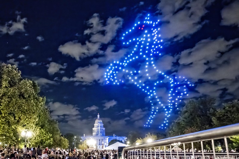 Blucifer lights up the sky above the Colorado Capitol building.