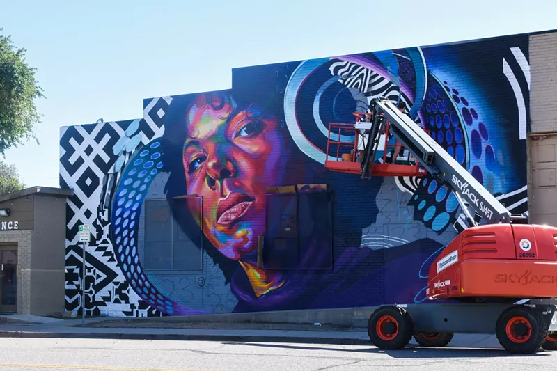 Image: Thomas “Detour” Evans, Anna Charney and A.L. Grime painted immigrant "Lucia Escalate" in Aurora.