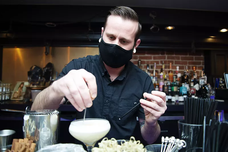 Image: Eric Tippett works the Luci's Shambles & Provisions bar on January 20.