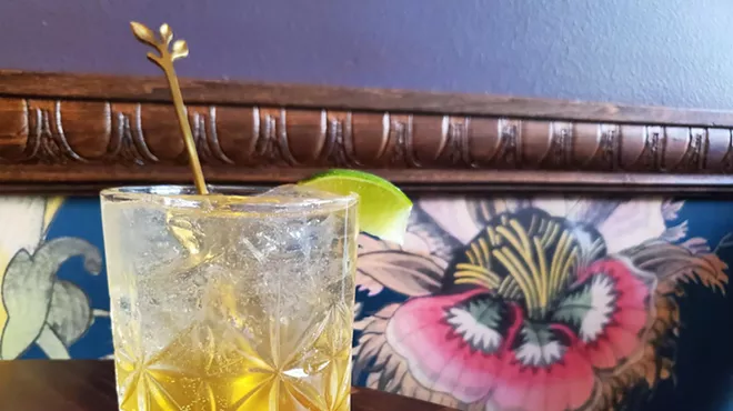 a cocktail on a wooden table