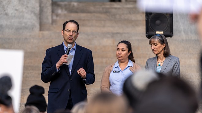 Colorado Attorney General Phil Weiser and Congresswoman Yadira Caraveo speak at a rally.