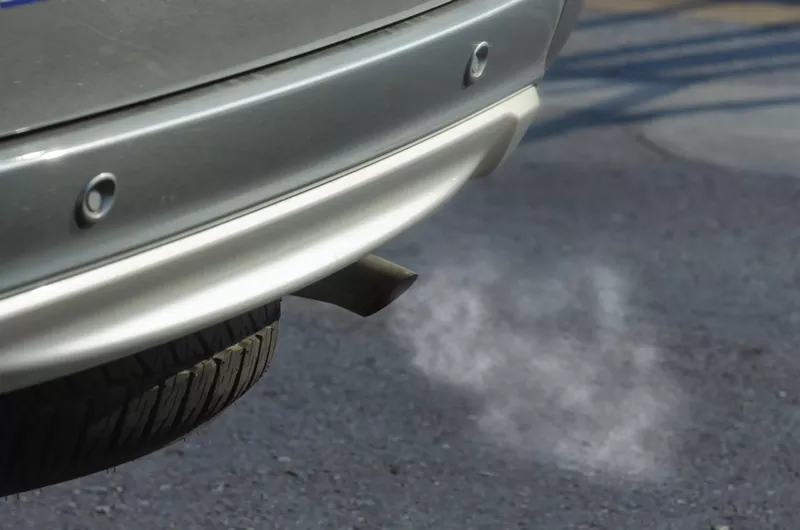 Image: Car exhaust pipe with smoke coming out