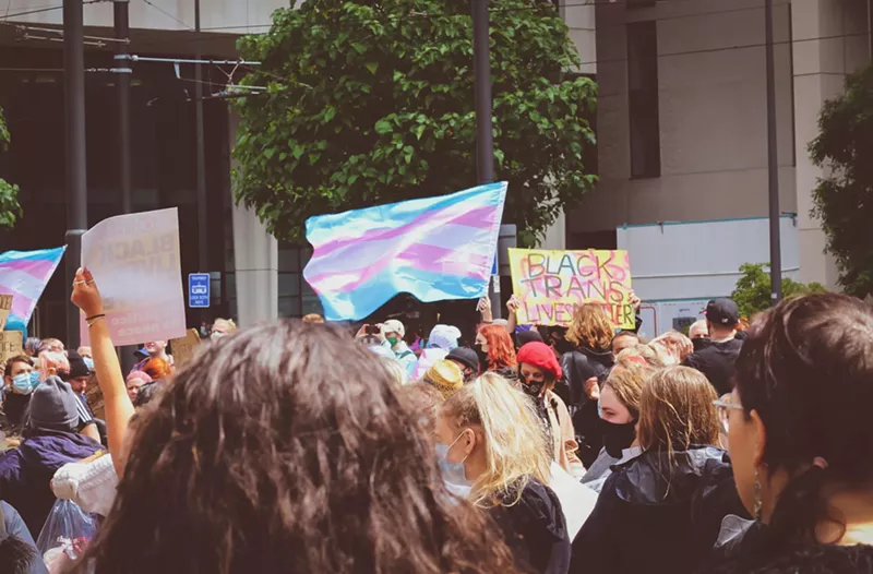 Image: Transgender flag held up during protest.