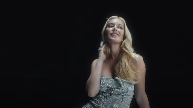 Heidi Montag posing in a silver dress