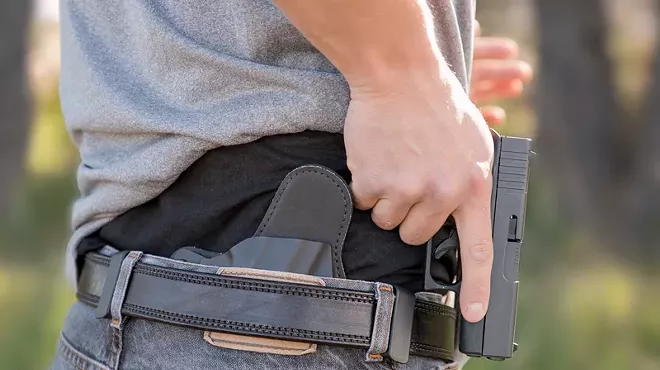 Man pulls handgun from concealed carry holster
