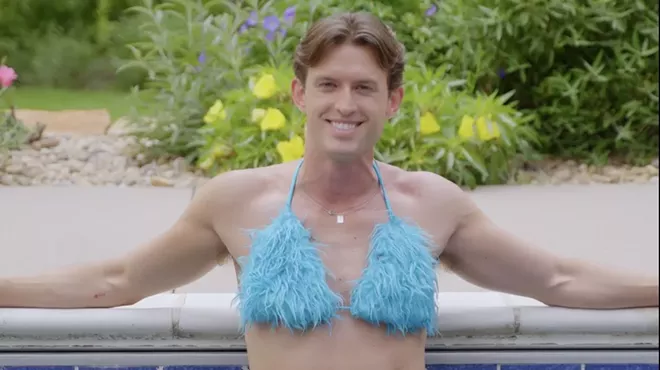 Connor Cole wears a fuzzy blue bikini set while in a pool, just like character Elle Woods did in Legally Blonde.