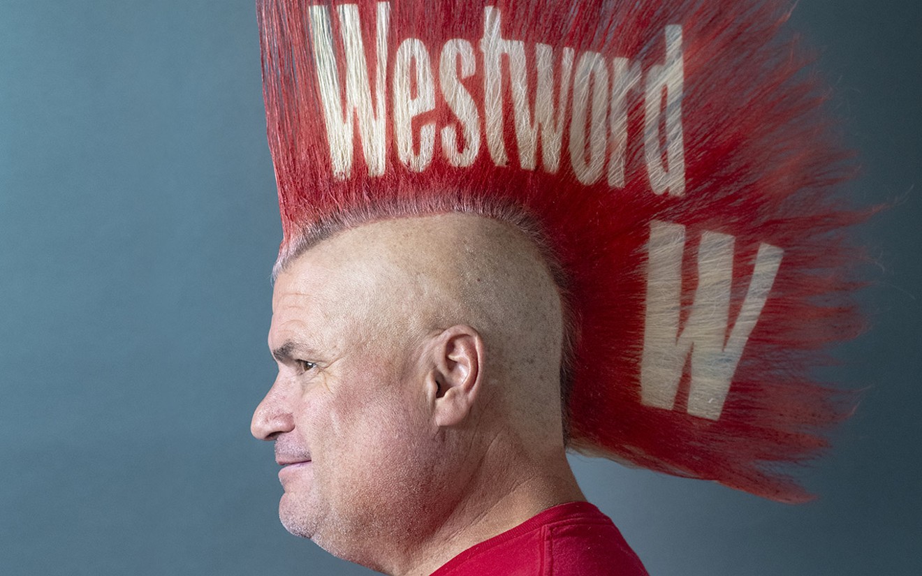 man with tall red mohawk with the words westword on it
