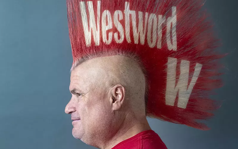 Image: man with tall red mohawk with the words westword on it