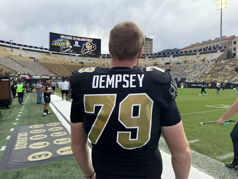 Image: University of Colorado football player on sidelines.