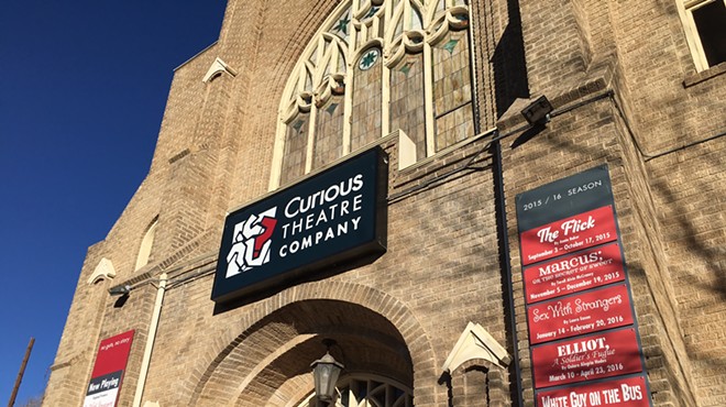 a church with the sign that says Curious Theatre