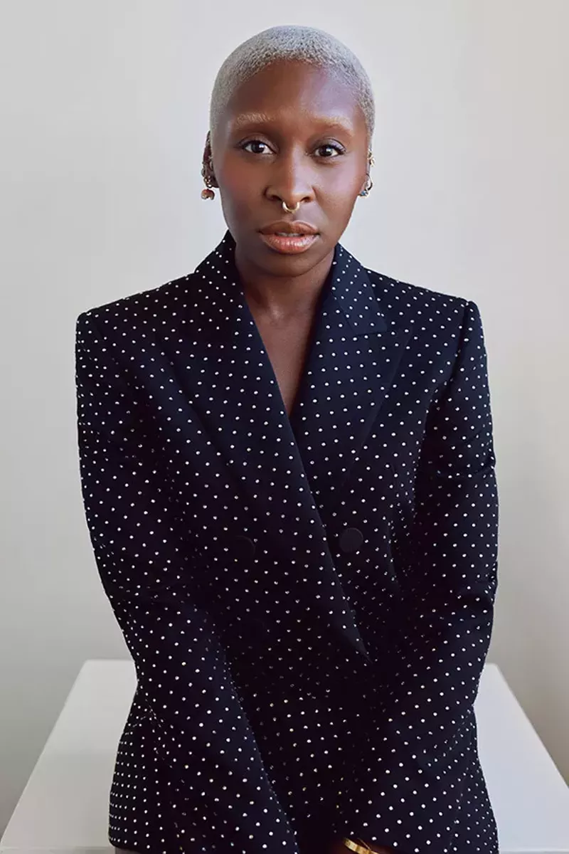 Image: A portrait of a woman in a dark suit