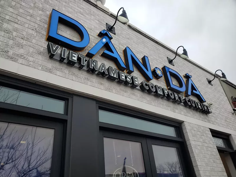 Image: sign that says "dan da" on the outside of a building