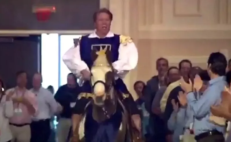 Image: Kent Thiry getting medieval at a DaVita event, as seen on Last Week Tonight With John Oliver.