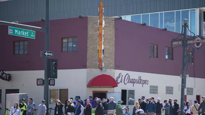 a line outside of a bar
