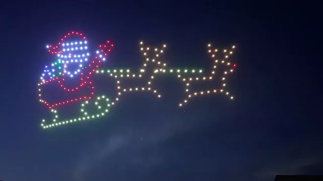 santa figure in lights in sky
