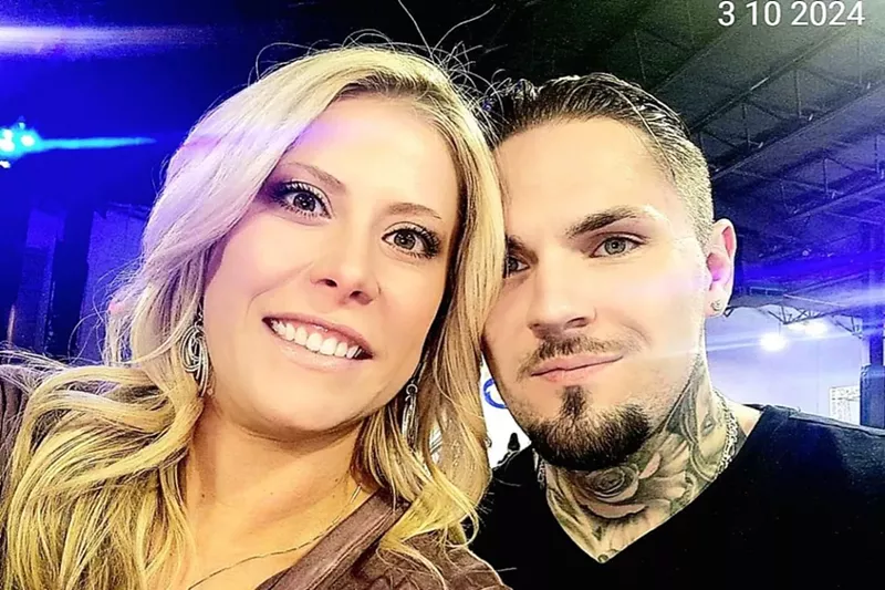 Image: A man and a woman smile.