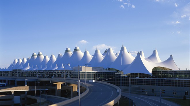 denver airport with tents and blue sky